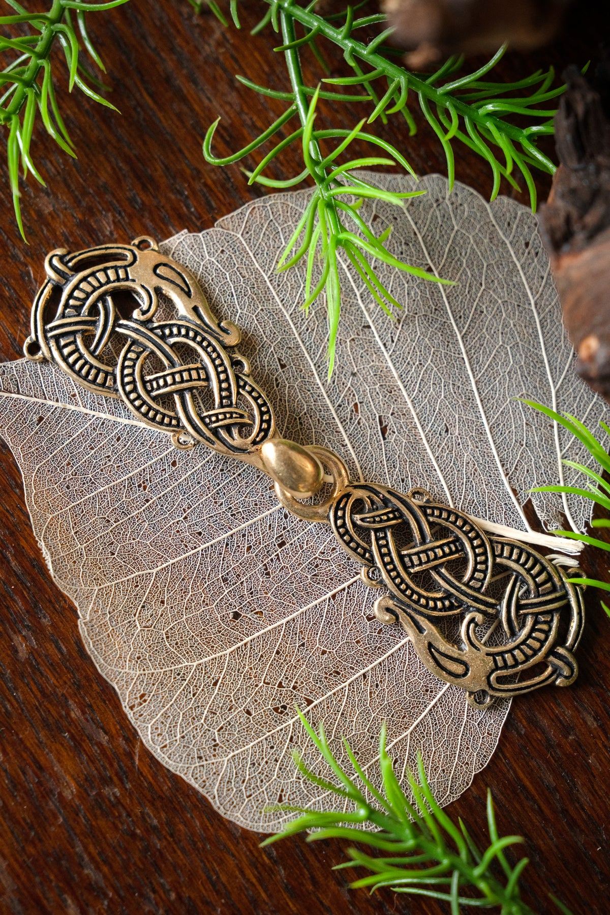 Cloak clasp with Midgard Serpent, bronze