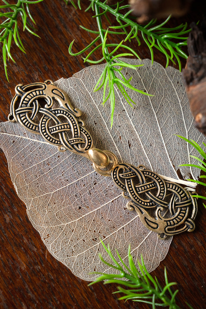 Cloak clasp with Midgard Serpent, bronze