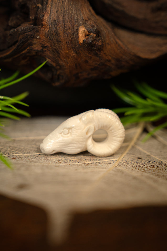Ram pendant, bone
