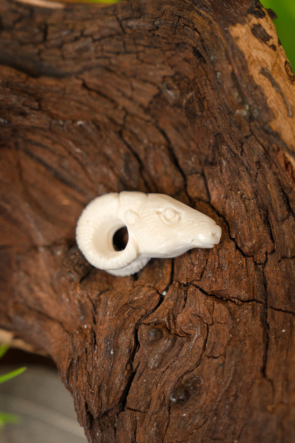 Ram pendant, bone