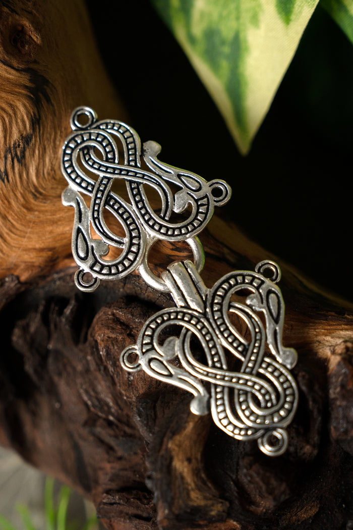 Cloak clasp Midgard snake Urnes style, silvered bronze