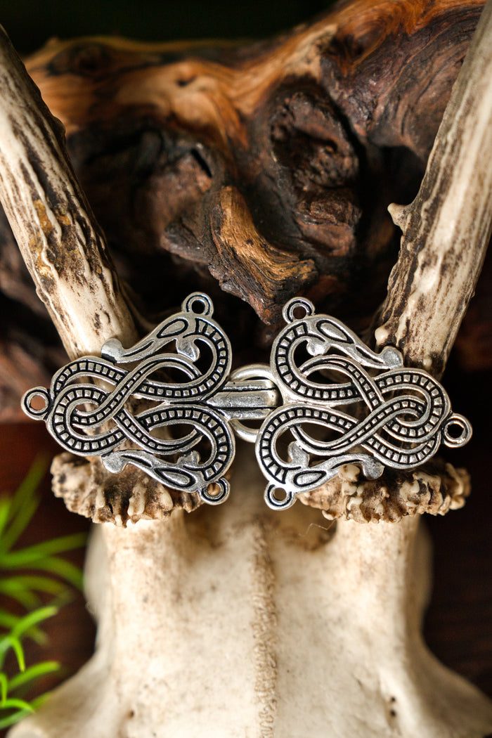 Cloak clasp Midgard snake Urnes style, silvered bronze