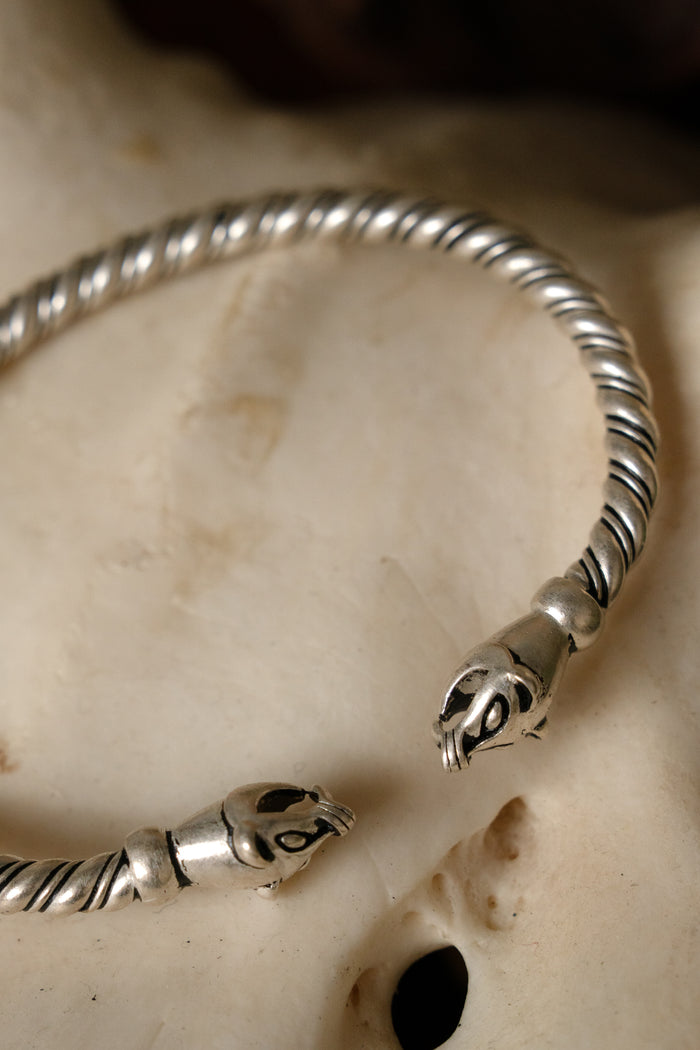 Viking bracelet with weasel heads, silvered bronze