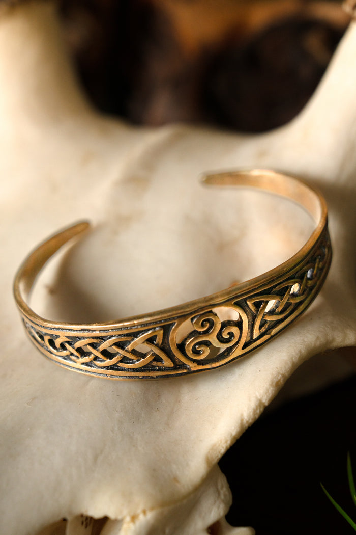 Narrow Celtic bracelet with trisquelion, bronze
