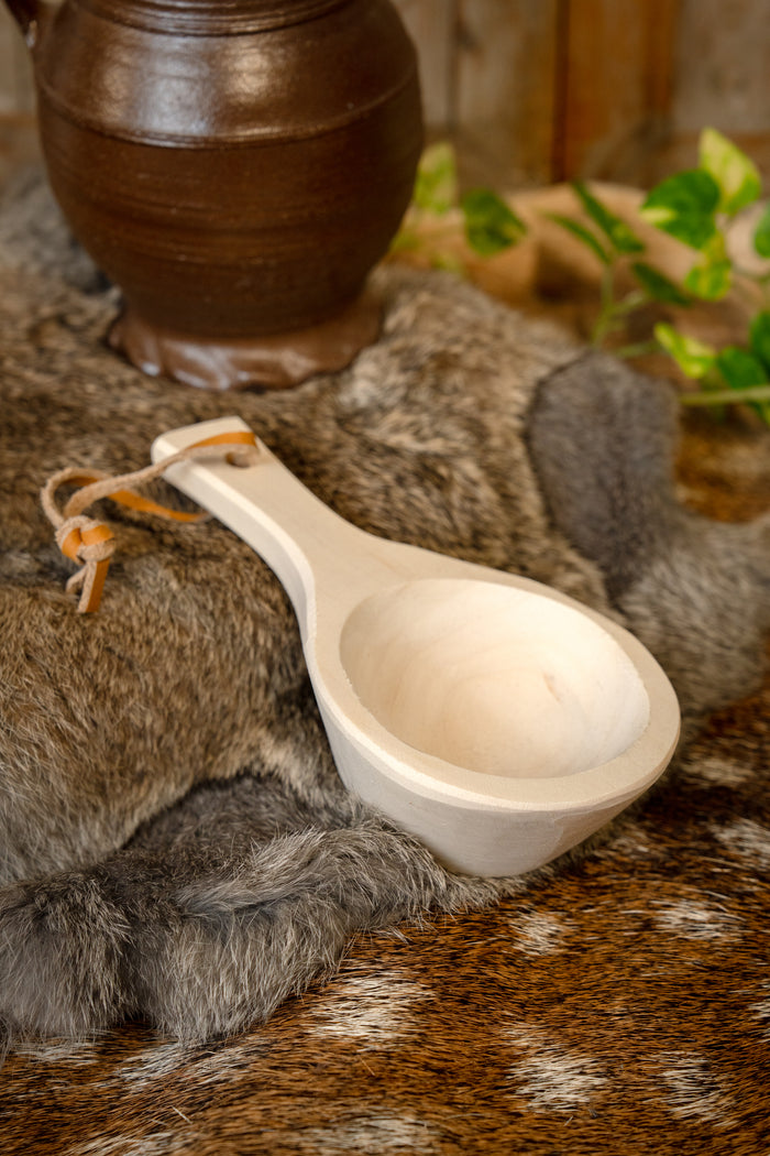 Serving spoon with leather cord