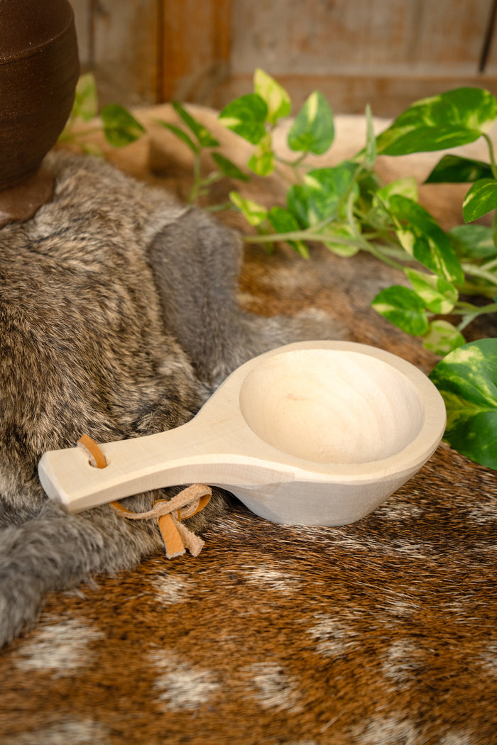 Serving spoon with leather cord