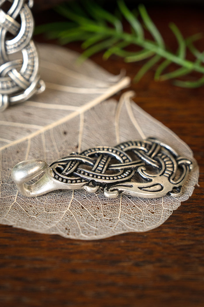 Silvered cloak clasp with Midgard snake, silvered bronze