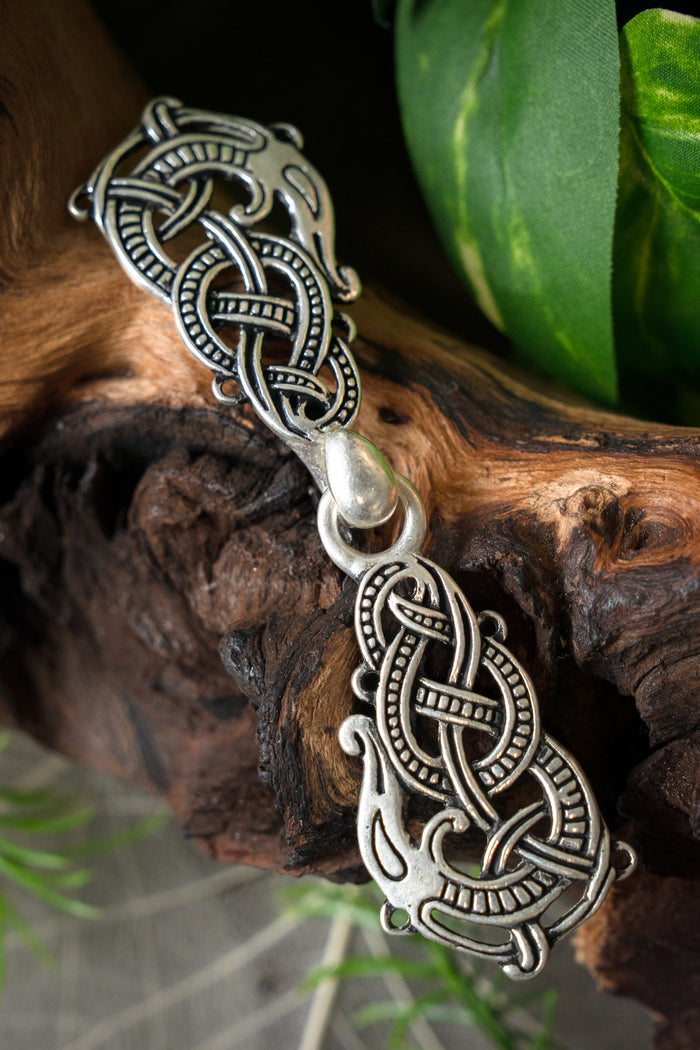 Silvered cloak clasp with Midgard snake, silvered bronze