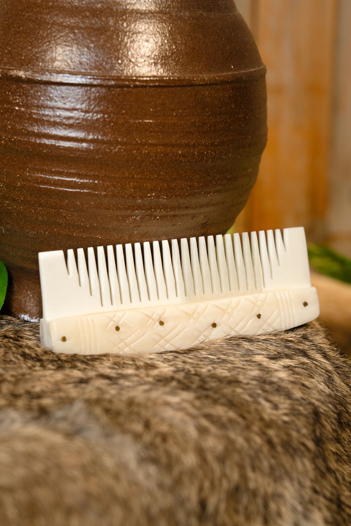 Bone Viking comb with stylised motifs