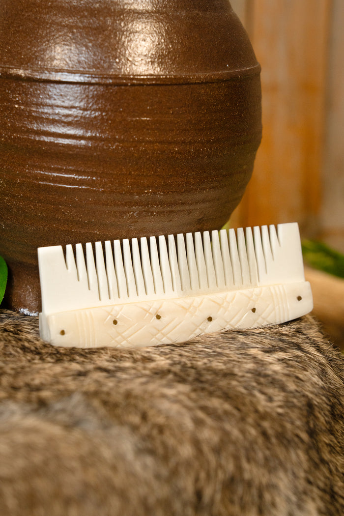 Bone Viking comb with stylised motifs
