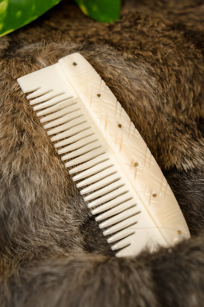 Bone Viking comb with stylised motifs
