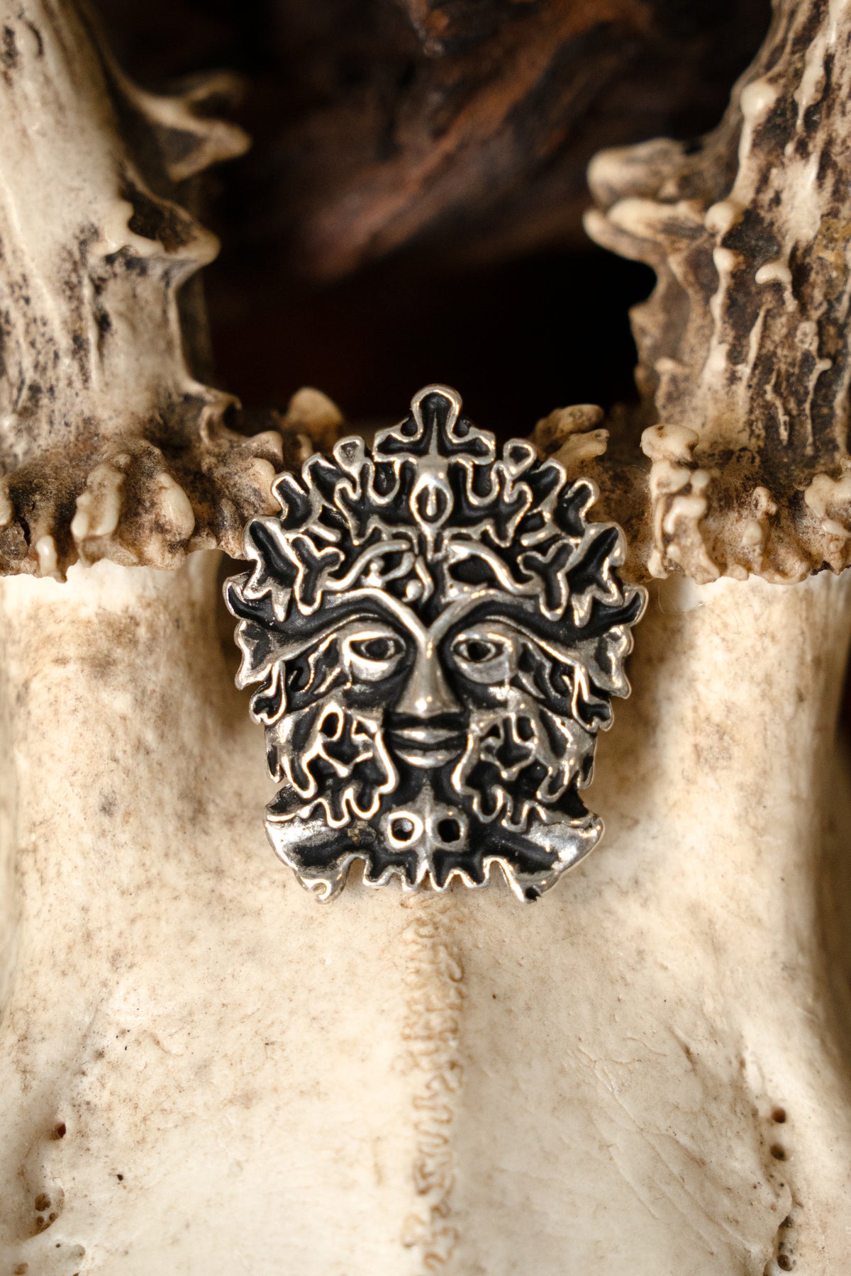 The Green Man amulet, silvered bronze