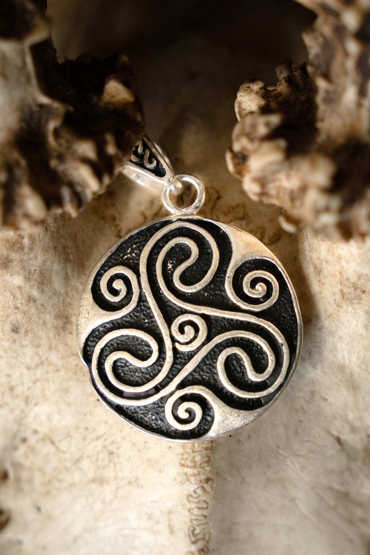 Amulet Celtic trisquelion, silvered bronze