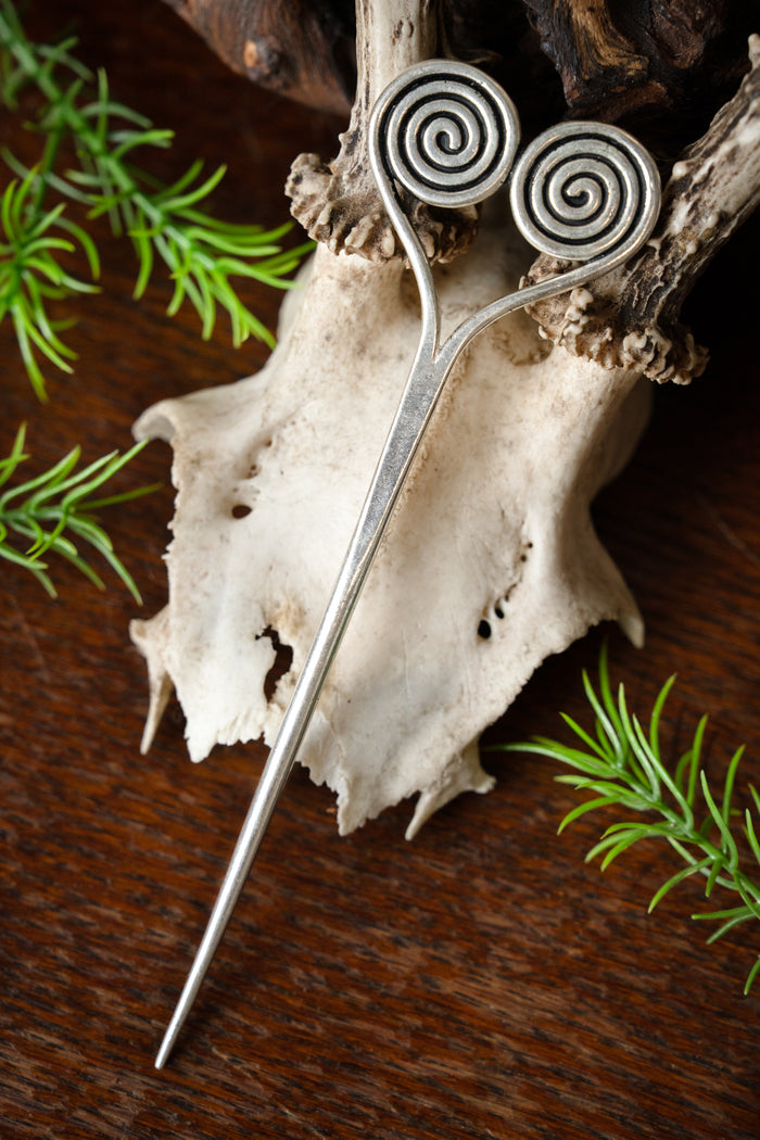 Bronze Age hairpin with spirals, silvered bronze
