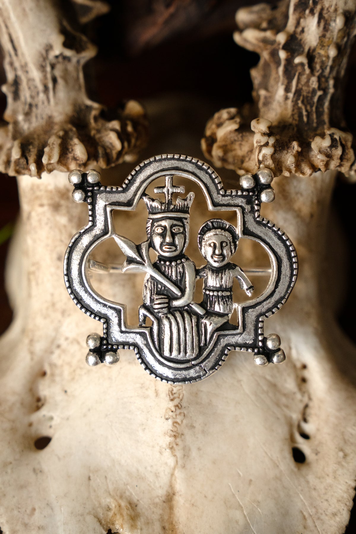 Medieval brooch Madonna, silvered bronze
