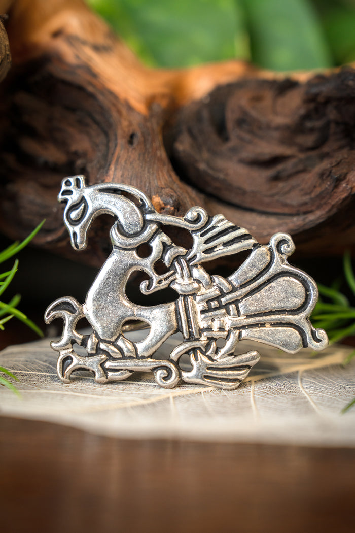 Viking peacock brooch, silvered bronze