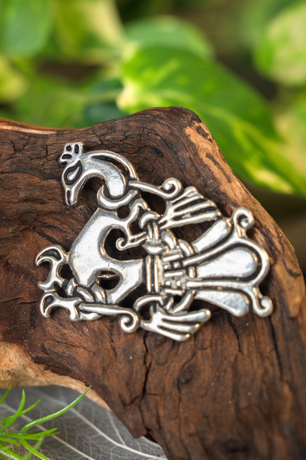 Viking peacock brooch, silvered bronze