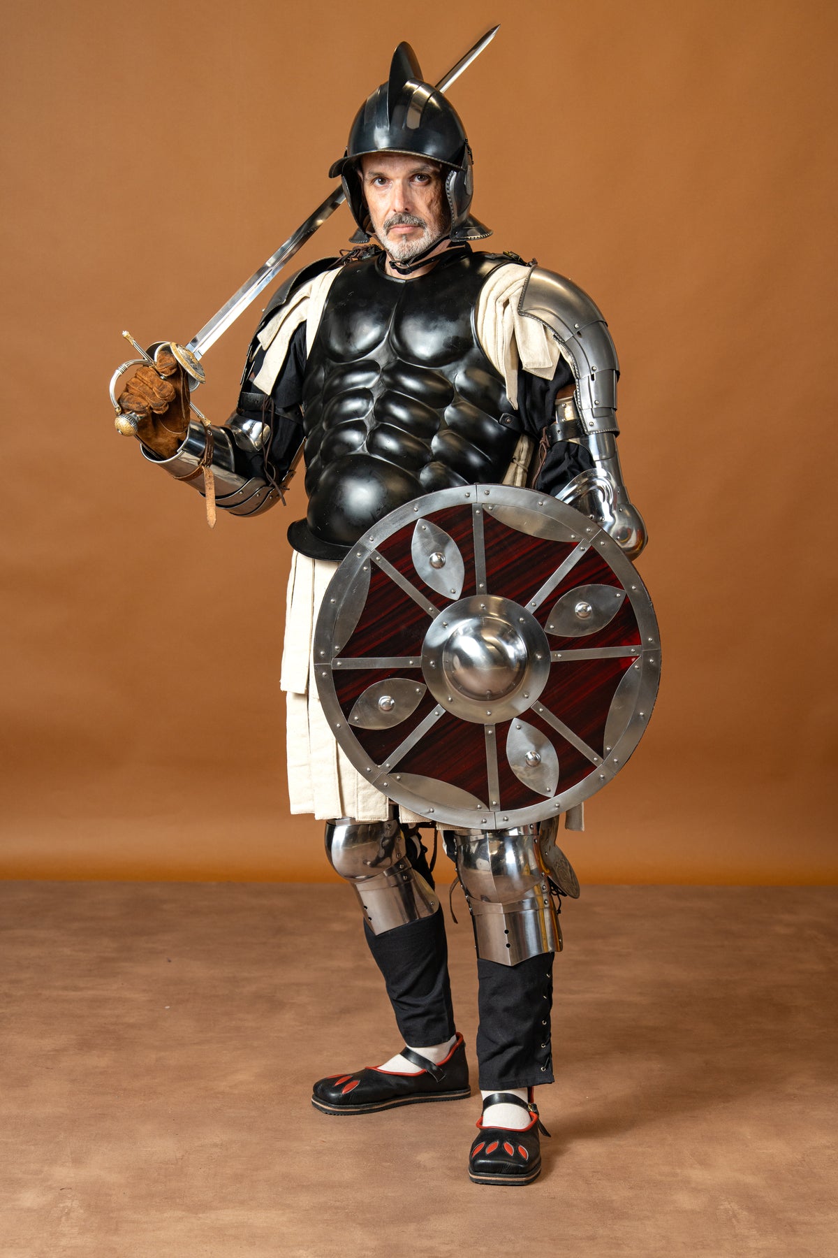 Beaten round shield