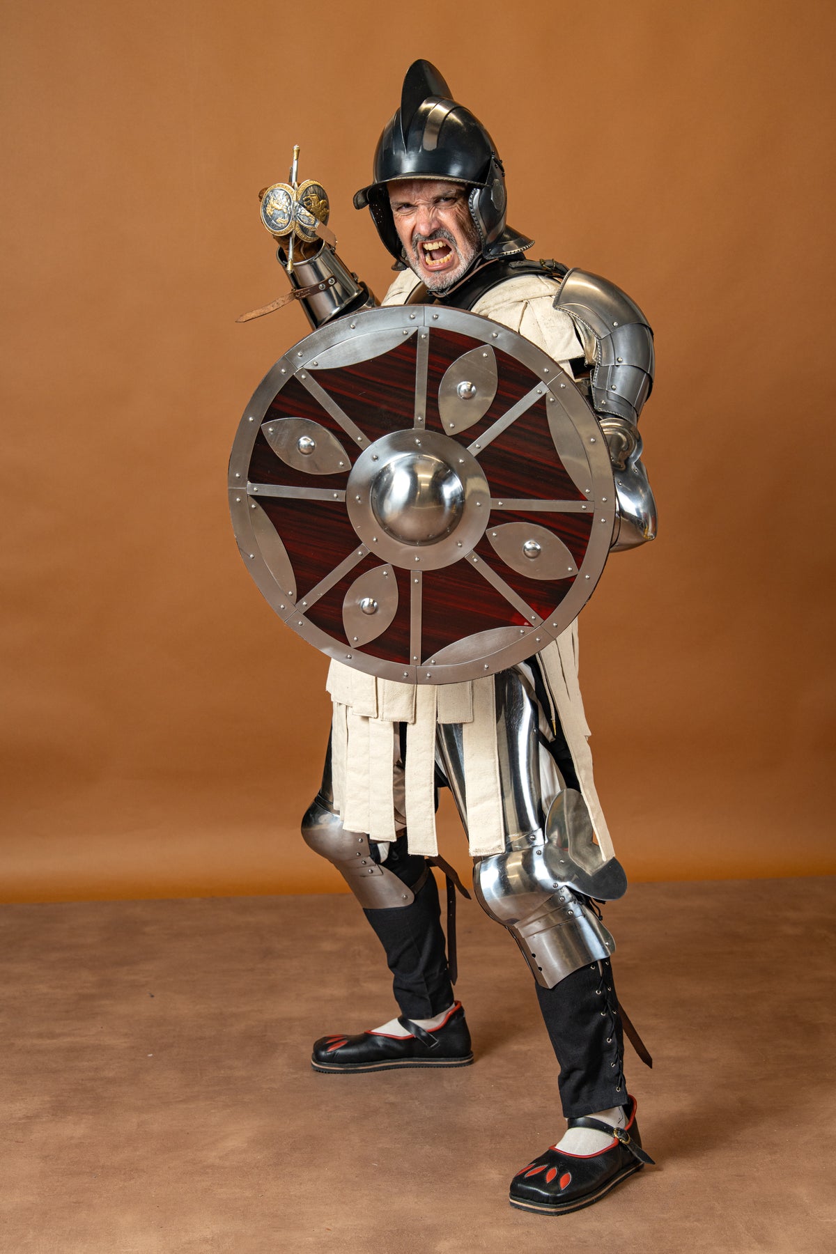 Beaten round shield