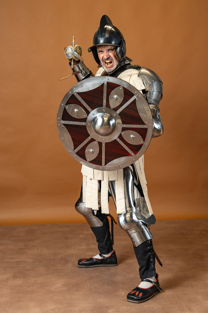 Beaten round shield