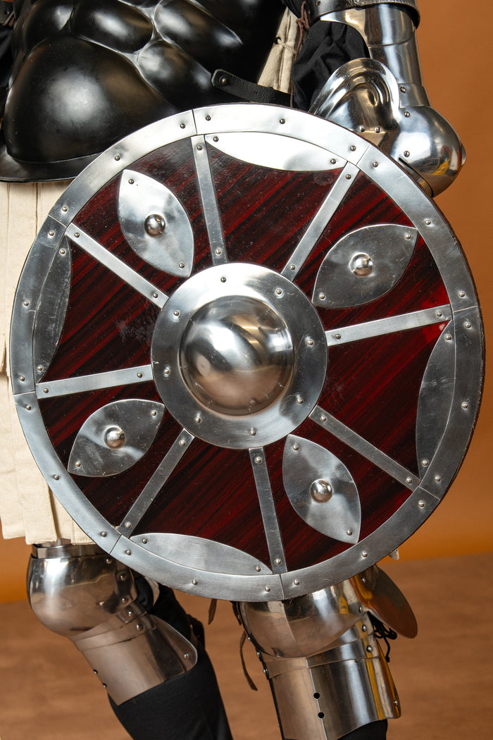 Beaten round shield
