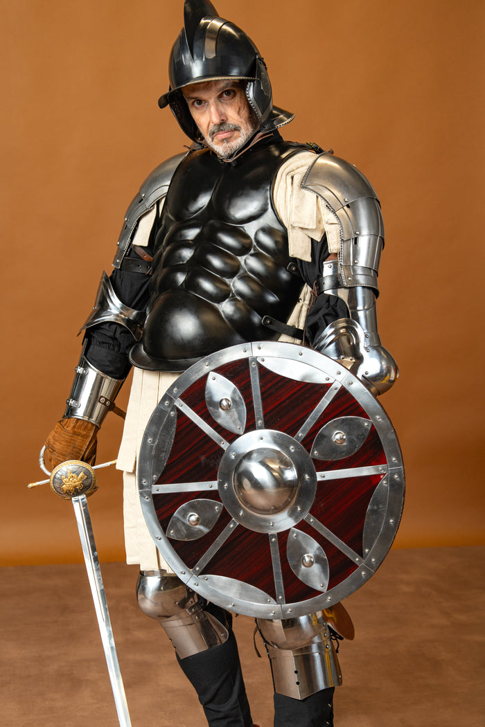 Beaten round shield