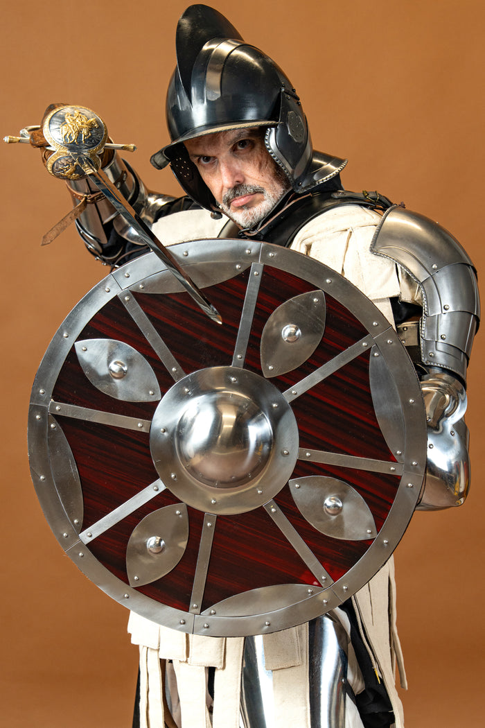 Beaten round shield