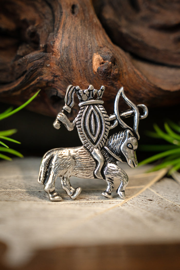 Pilgrim badge vulva on horseback, silvered bronze