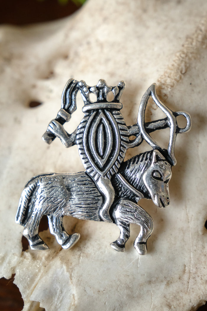 Pilgrim badge vulva on horseback, silvered bronze
