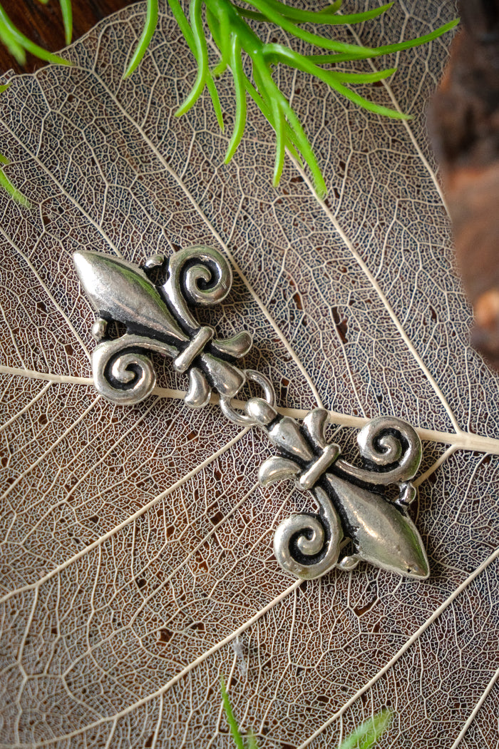 Cloak clasp fleur de lys, silvered bronze