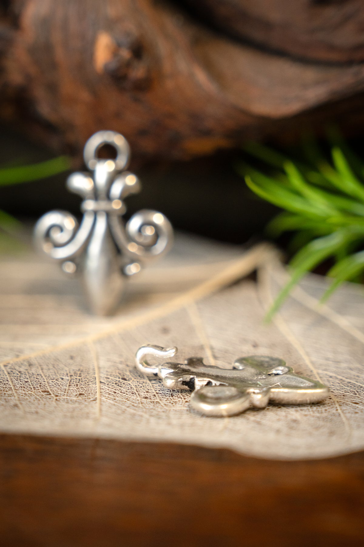 Cloak clasp fleur de lys, silvered bronze