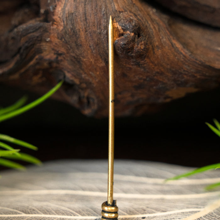 Medieval pin for headwear, brass