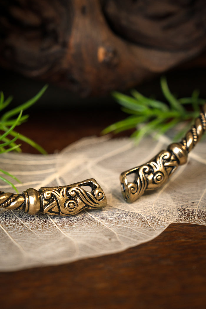 Viking torque with dragon heads, bronze