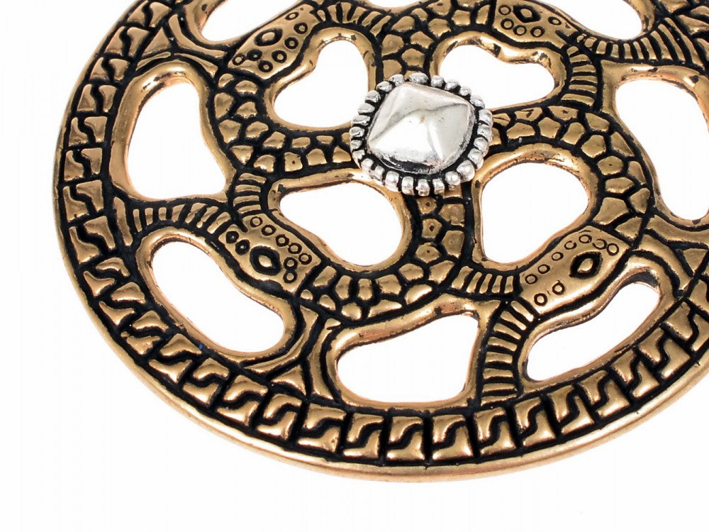 Alemannic decorative disc with snake motif, silvered bronze