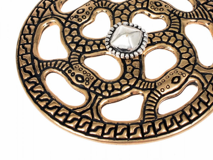 Alemannic decorative disc with snake motif, silvered bronze