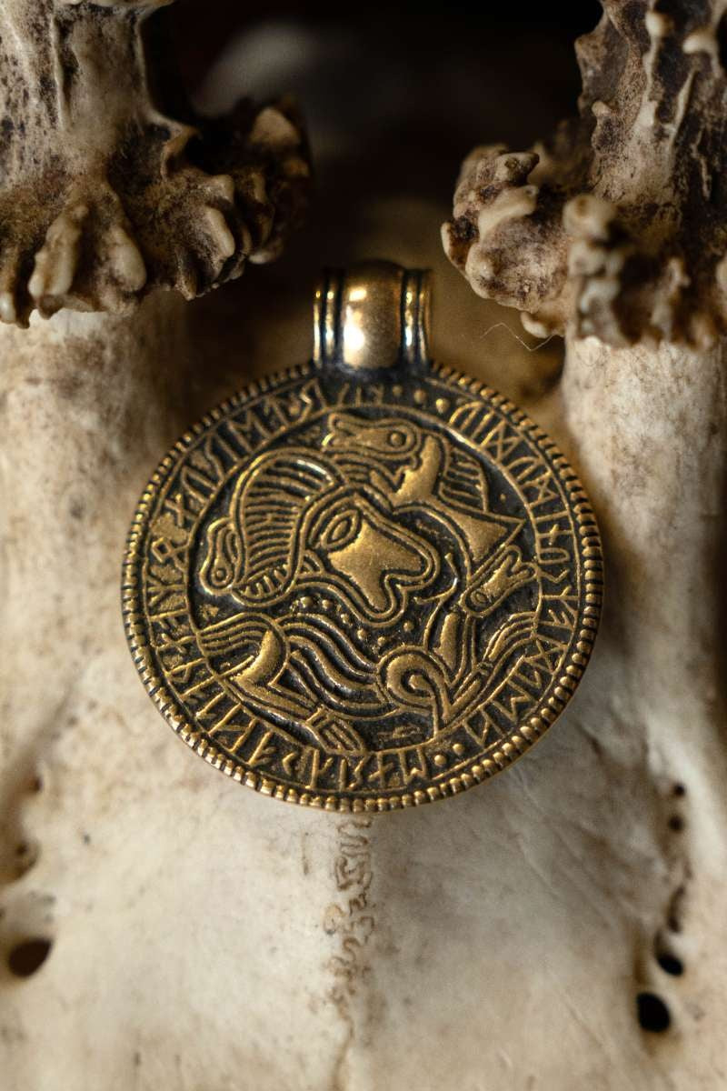 Vendel bracteate amulet Tjurko, bronze