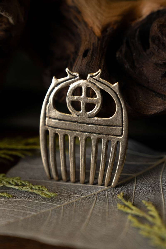 Bronze Age comb with sunwheel, bronze
