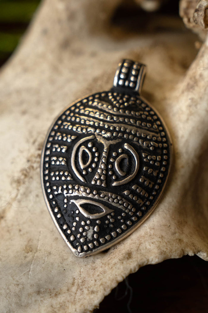 Viking Odin mask amulet Gotland, silvered bronze