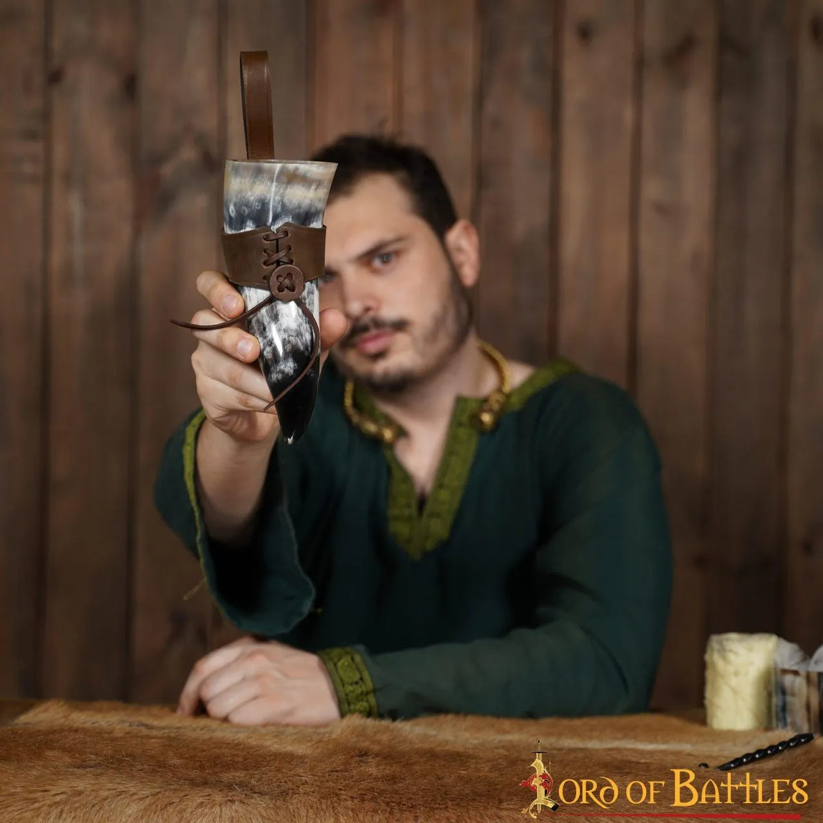Natural drinking horn with leather holder