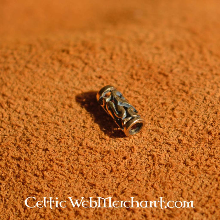 Elongated beard bead with spiral motifs, bronze