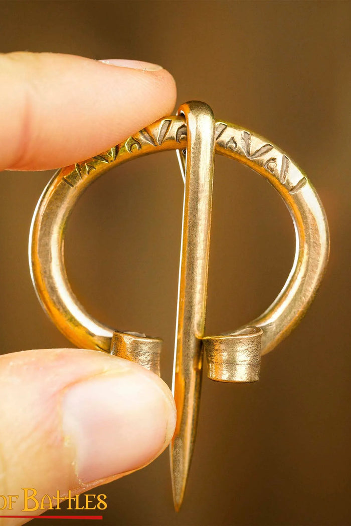 Early medieval horseshoe fibula, brass