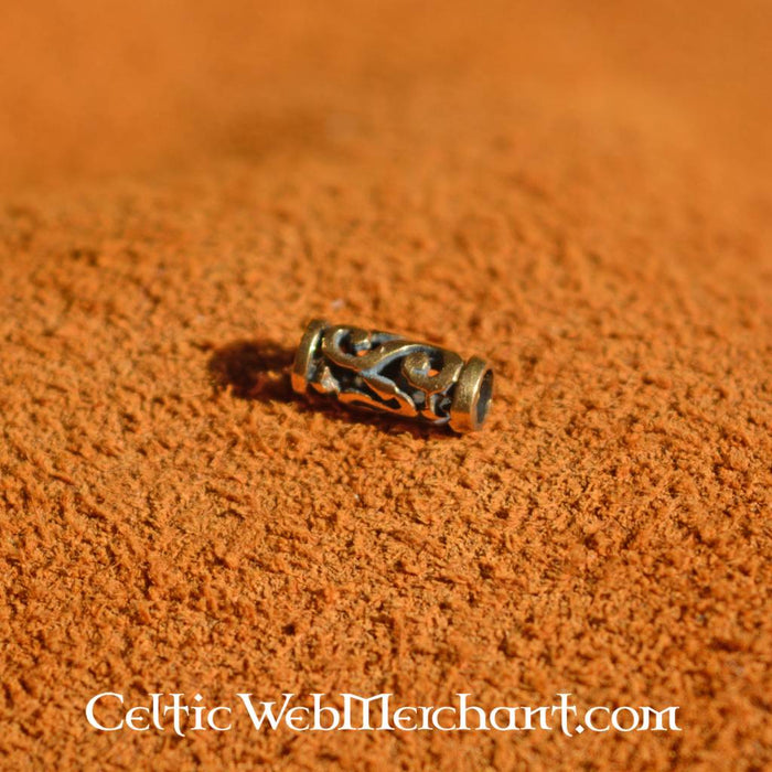 Elongated beard bead with spiral motifs, bronze