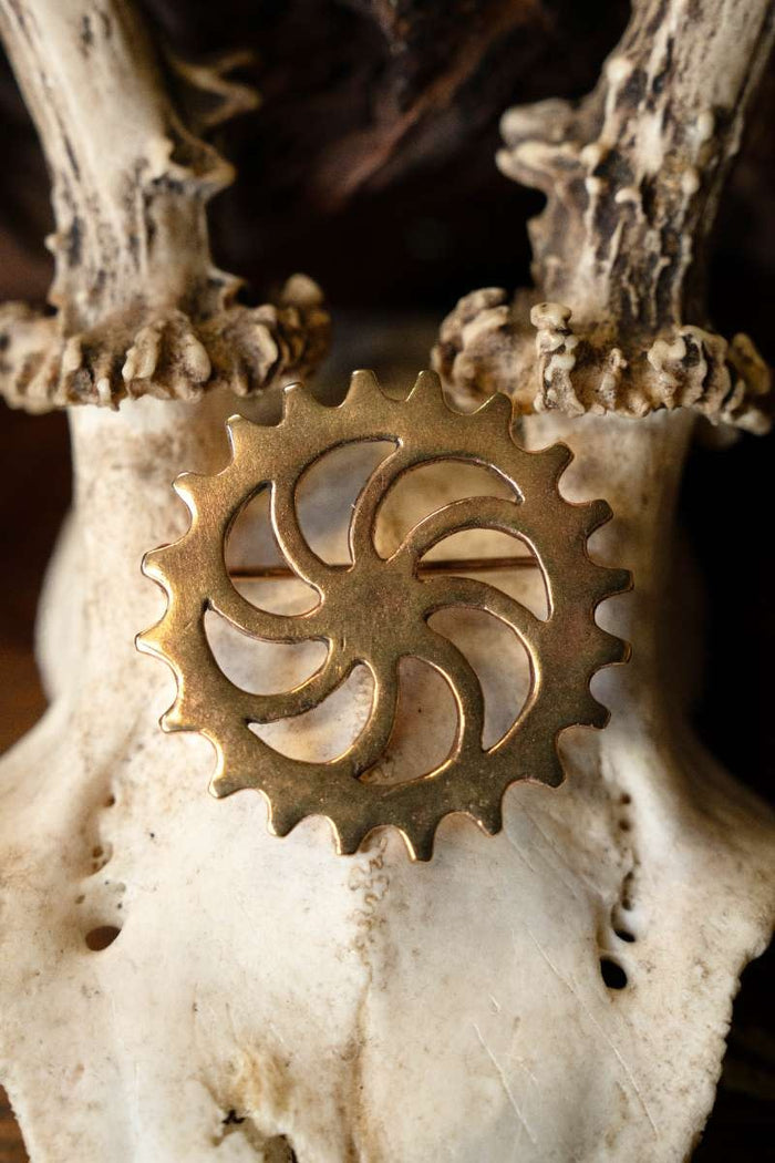 Roman disc fibula sun wheel, bronze