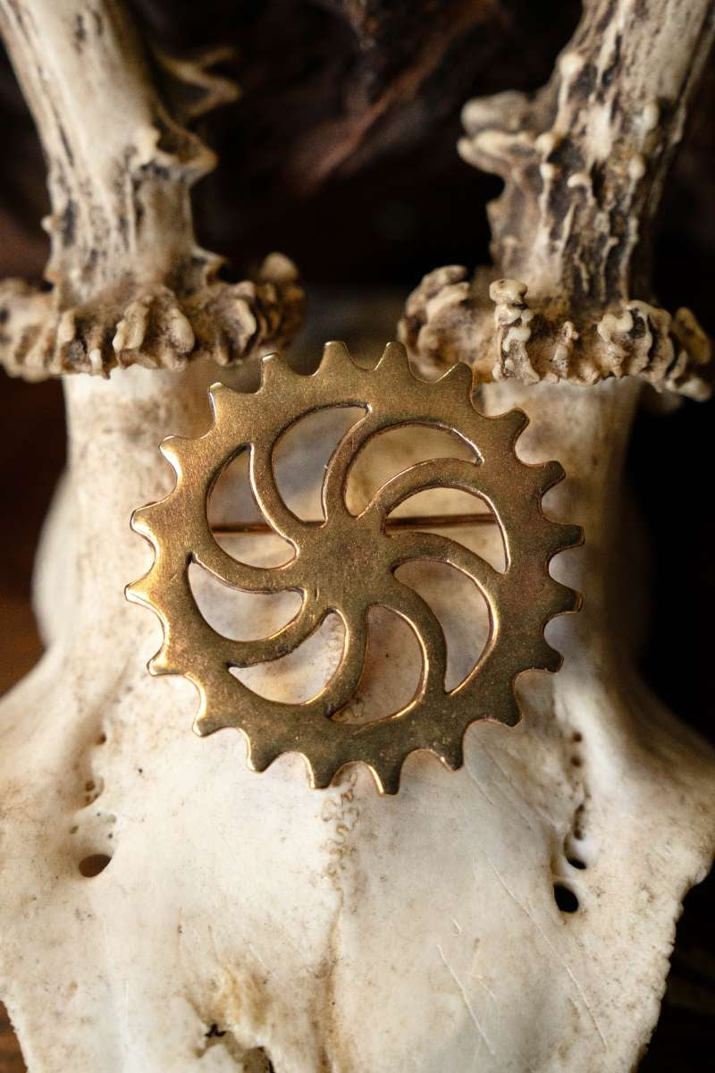 Romeinse schijffibula zonnewiel, brons