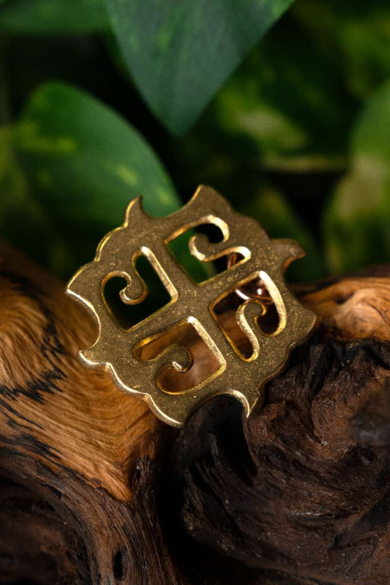 Roman disc fibula sun cross, bronze