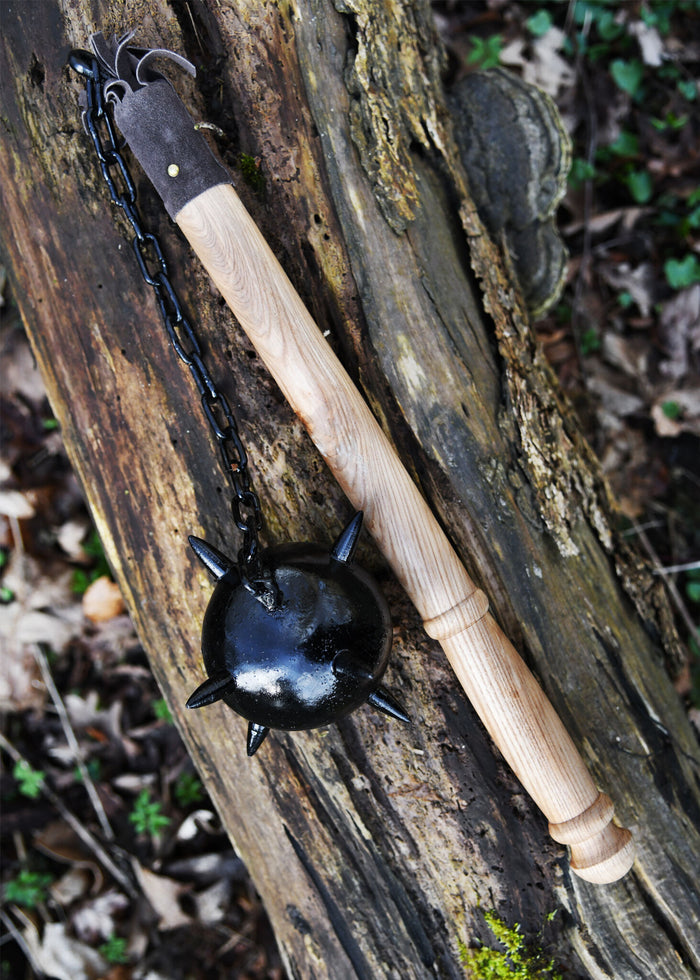 Flail with wooden ball