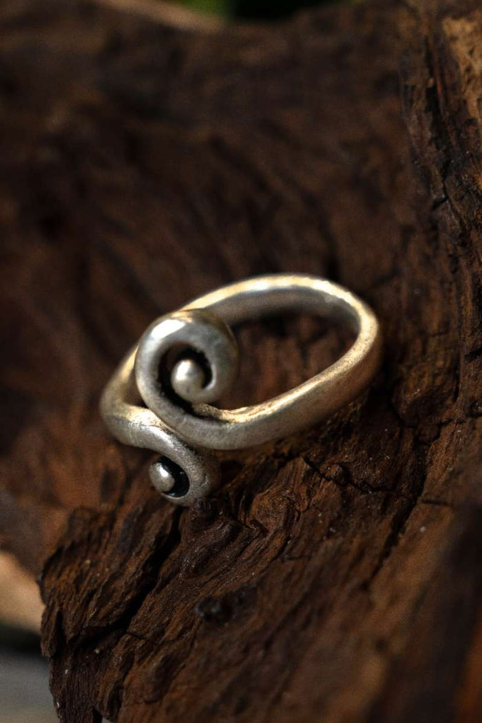 Celtic ring with stylized spiral motif, silvered bronze