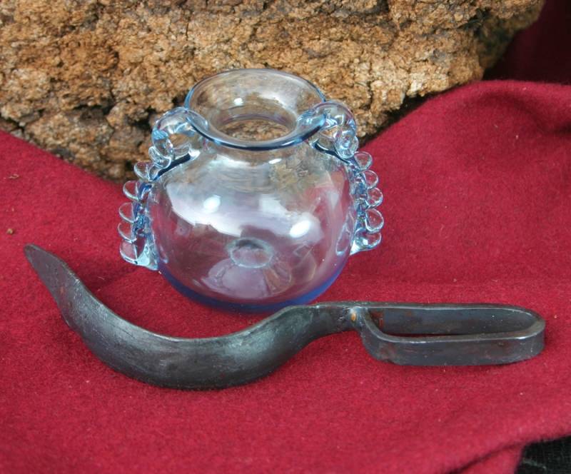 Strigile en fer romain