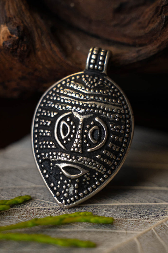 Viking Odin mask amulet Gotland, silvered bronze