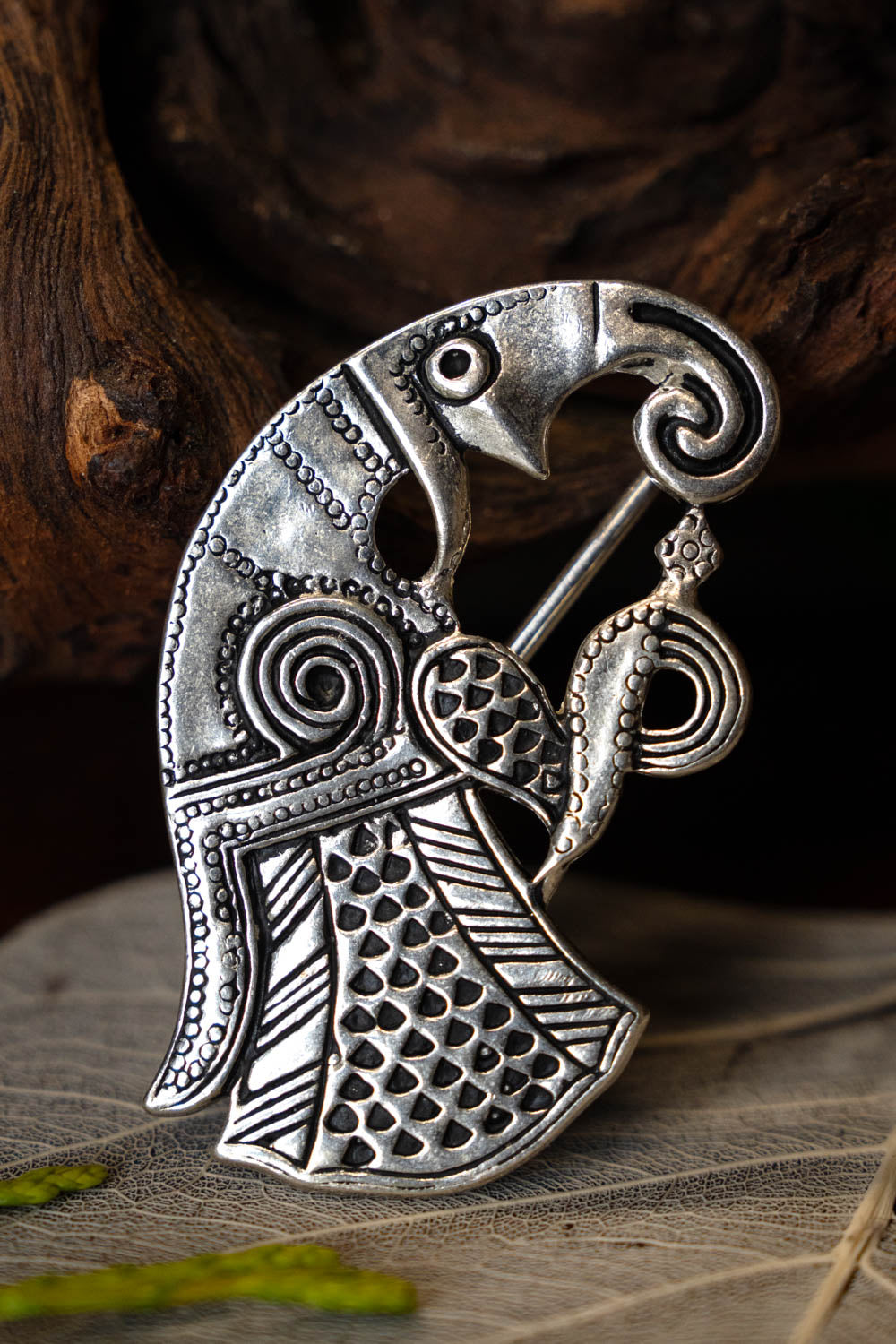 Vendel raven brooch Gotland, right-facing, silvered bronze
